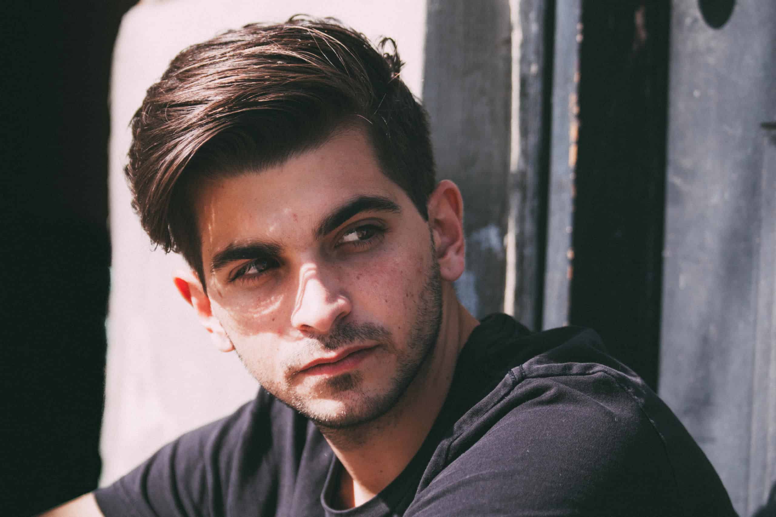 Filmmaker Jorge Thielen-Armand, a young man with dark hair and stubble, looking off to the side.