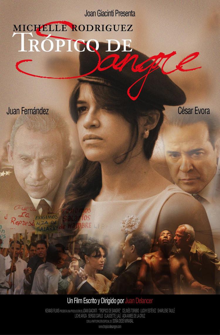 Film poster for the Dominican film Trópico de Sangre, featuring Michelle Rodriguez, Juan Fernández, and César Évora, with a crowd scene and protest text overlaid.