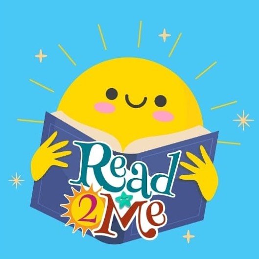 A smiling yellow sun character holding an open book with the text “Read 2 Me” on the cover, perfect for bedtime stories.